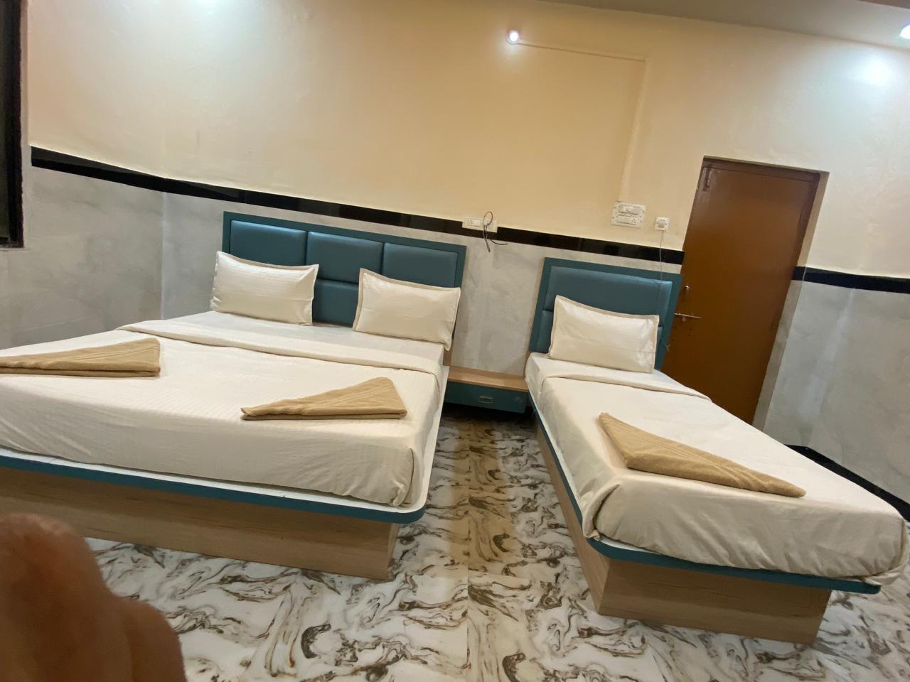 Twin room at Tirumal Lodge Saundatti